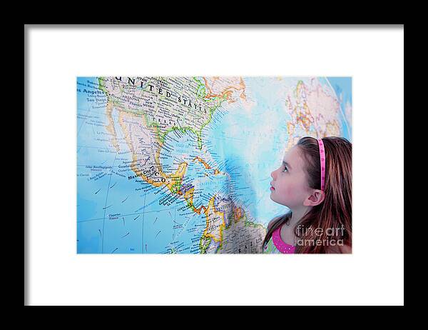 World Framed Print featuring the photograph Girl Looking At Map Of The Usa by Conceptual Images/science Photo Library