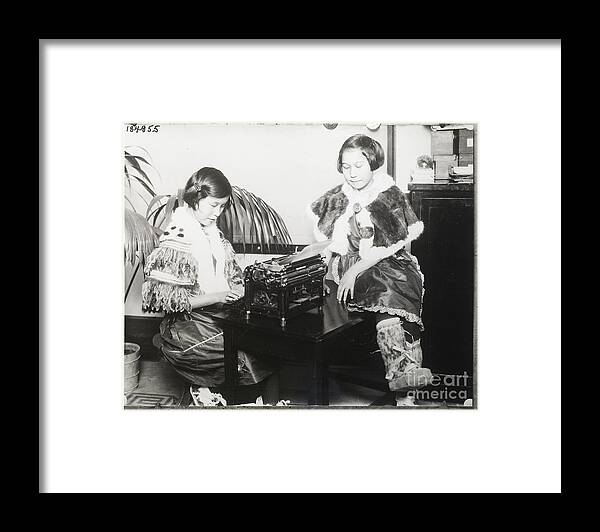 Child Framed Print featuring the photograph Girls Seated At Typewriter by Bettmann