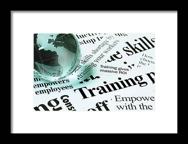 Employment And Labor Framed Print featuring the photograph Glass Globe Paperweight On Headlines by Rapideye