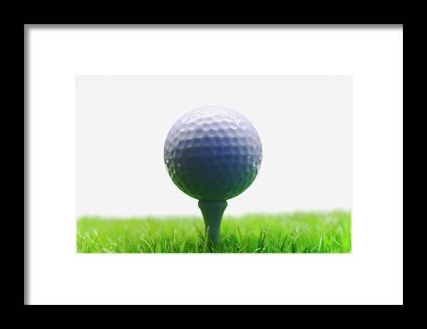 Grass Framed Print featuring the photograph Golf Ball On Tee by Buena Vista Images