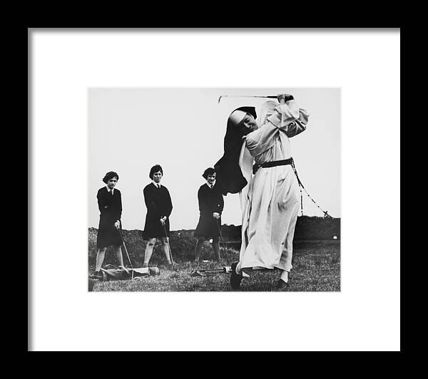 Education Framed Print featuring the photograph Golfing Nun by Central Press