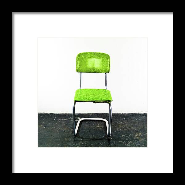 Single Object Framed Print featuring the photograph Green Chair On A Black Floor by Jay B Sauceda
