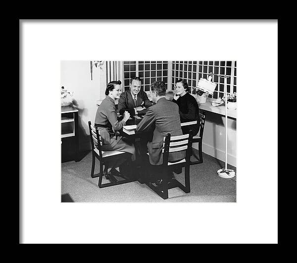 Heterosexual Couple Framed Print featuring the photograph Group At A Table by George Marks