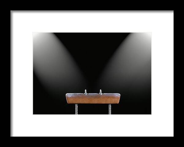 Black Background Framed Print featuring the photograph Gymnastics Pommel Horse Illuminated By by David Madison