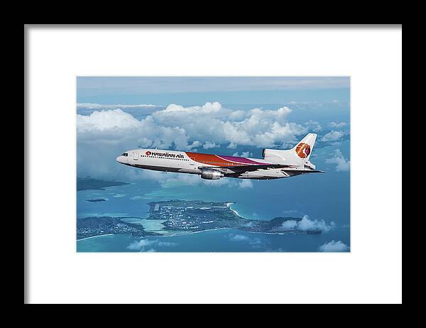 Hawaiian Airlines Framed Print featuring the mixed media Hawaiian Airlines L-1011 Over the Islands by Erik Simonsen