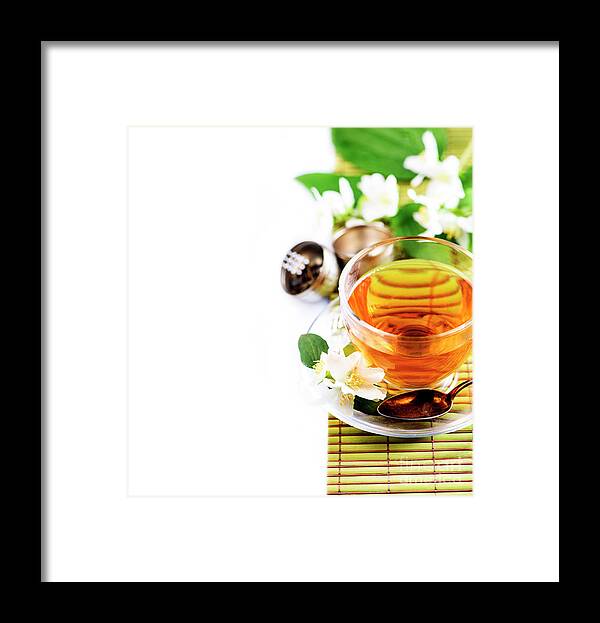 Tea Framed Print featuring the photograph Herbal green tea with jasmine flower in transparent teacup borde by Jelena Jovanovic