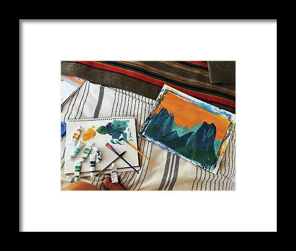Paintings Framed Print featuring the photograph High Angle View Of Paintings With Paint Tubes And Paintbrushes On Bed In Motor Home by Cavan Images