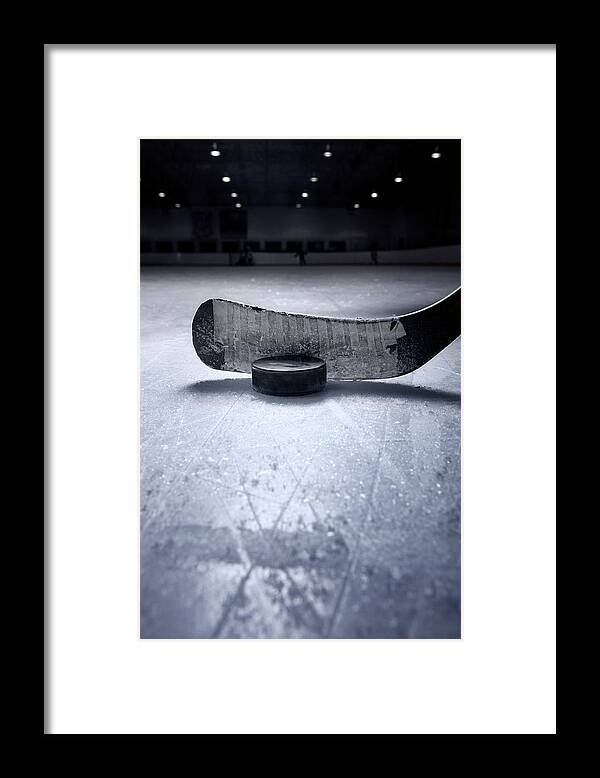 Recreational Pursuit Framed Print featuring the photograph Hockey Stick And Puck by Francisblack