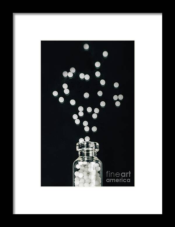 Homeopathy Framed Print featuring the photograph Homeopathic Globules Scattered Out Of Glass Bottle by Microgen Images/science Photo Library
