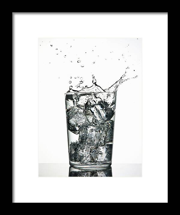 White Background Framed Print featuring the photograph Ice Cubes Splashing Into Fizzy Drink by Walter Zerla