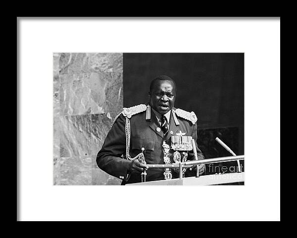 Following Framed Print featuring the photograph Idi Amin Addressing The United Nations by Bettmann