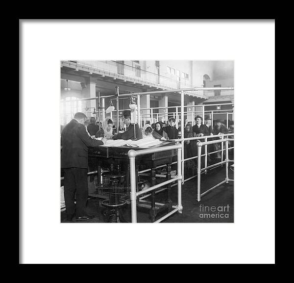 Crowd Of People Framed Print featuring the photograph Immigrants Having Papers Checked by Bettmann