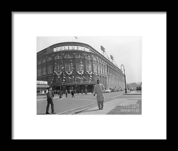 People Framed Print featuring the photograph Jackie Robinson Leaving Ebbets Field by Bettmann