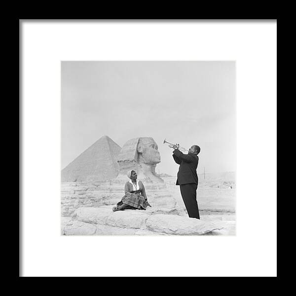 People Framed Print featuring the photograph Jazz Trumpeter Louis Armstrong Playing by Bettmann