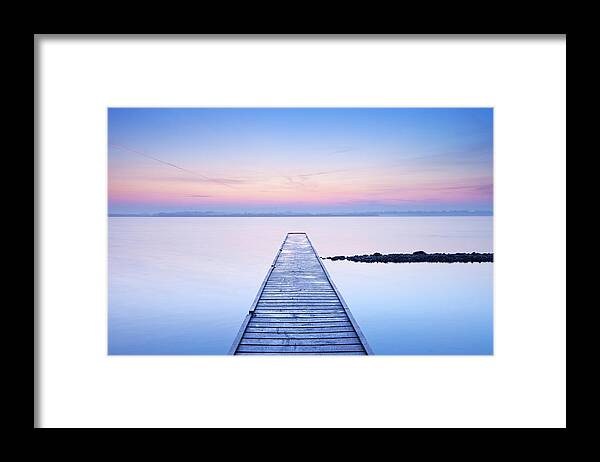 Water's Edge Framed Print featuring the photograph Jetty On A Still Lake At Sunrise by Sara winter