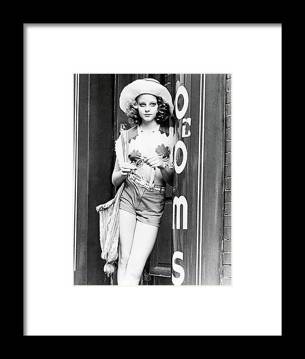 Jodie Foster Framed Print featuring the photograph JODIE FOSTER in TAXI DRIVER -1976-. by Album