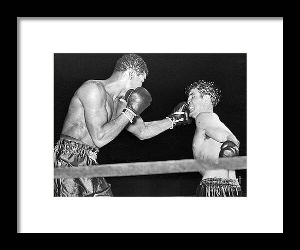 People Framed Print featuring the photograph Joe Louis Boxing With Billy Conn by Bettmann