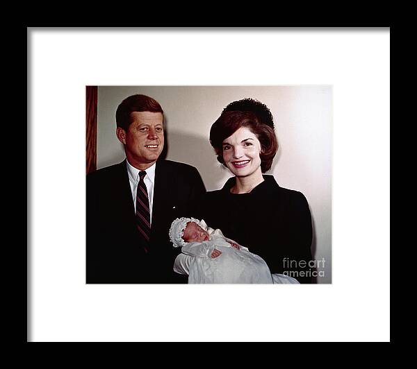 People Framed Print featuring the photograph John F Kennedy With Jackie Holding Son by Bettmann