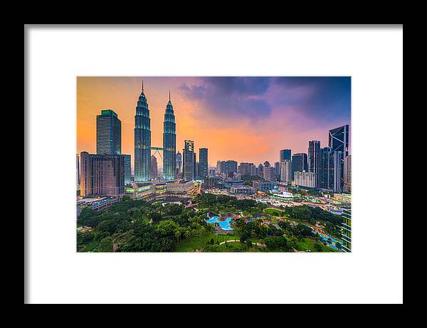 Cityscape Framed Print featuring the photograph Kuala Lumpur, Malaysia Skyline At Dusk by Sean Pavone