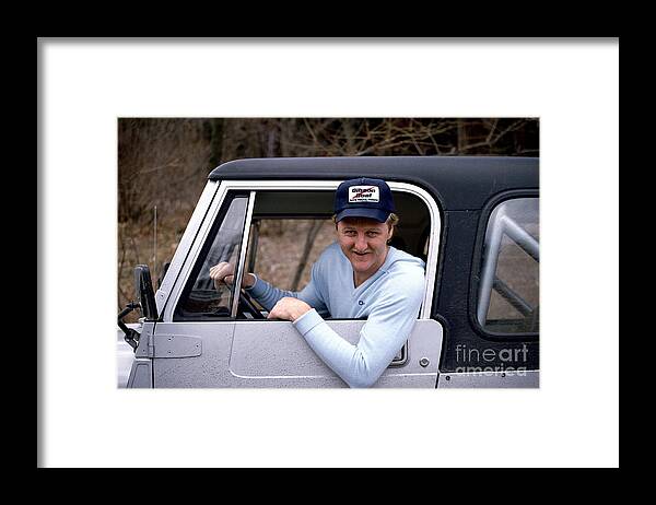 1980-1989 Framed Print featuring the photograph Larry Bird Poses In His Truck by Ken Regan