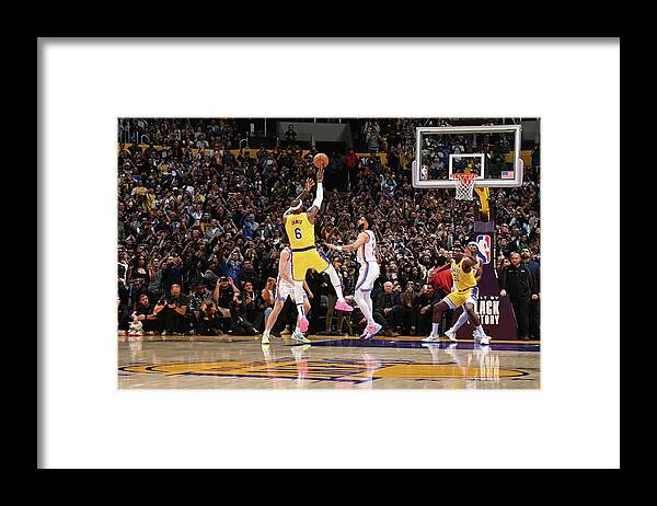 Lebron James Framed Print featuring the photograph LeBron James Shoots to Break the All-Time Scoring Record by Andrew D. Bernstein