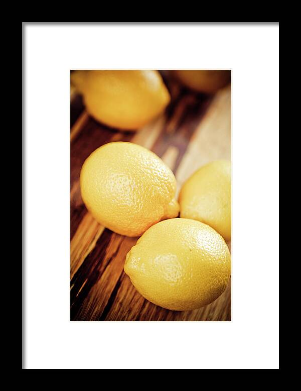 Cutting Board Framed Print featuring the photograph Lemons by Mmeemil