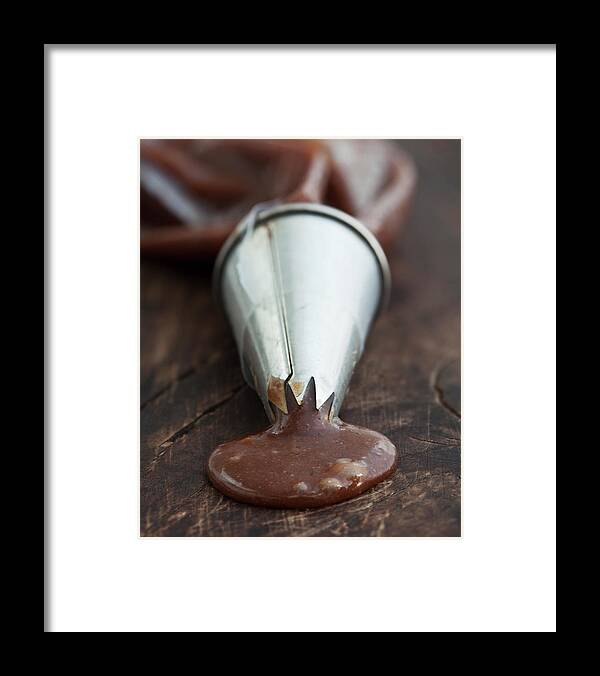 Unhealthy Eating Framed Print featuring the photograph Liquidized Chocolate Coming Out From by Lindeblad, Matilda