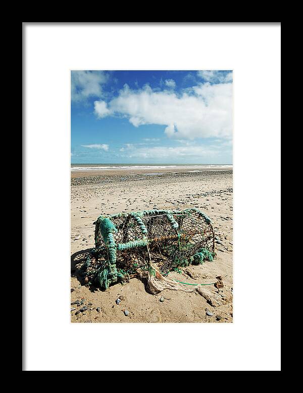 Shadow Framed Print featuring the photograph Lobster Pot On A Deserted Beach by Jon Boyes