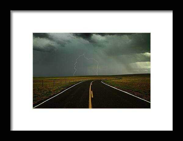 Tranquility Framed Print featuring the photograph Long And Winding Road Against Lighting by Davearnoldphoto.com