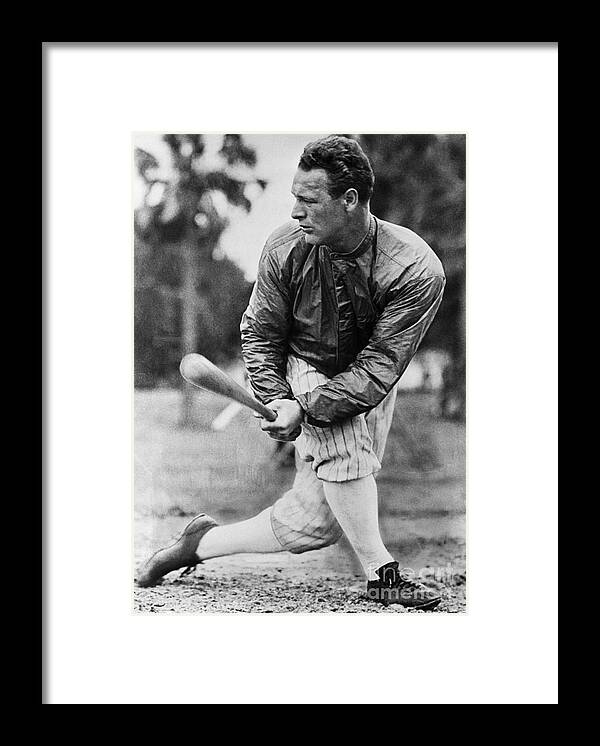 Disbelief Framed Print featuring the photograph Lou Gehrig In Jacket Swinging by Bettmann