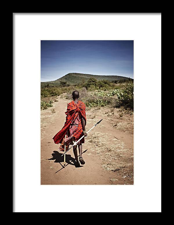 Young Men Framed Print featuring the photograph Maasai Man Walking On Dirt Road by Niels Busch