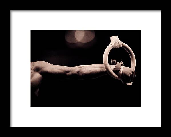 Human Arm Framed Print featuring the photograph Male Gymnast On Rings, Close-up by David Madison