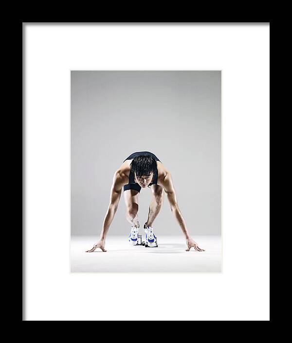 People Framed Print featuring the photograph Male Runner In Starting Blocks by Ting Hoo