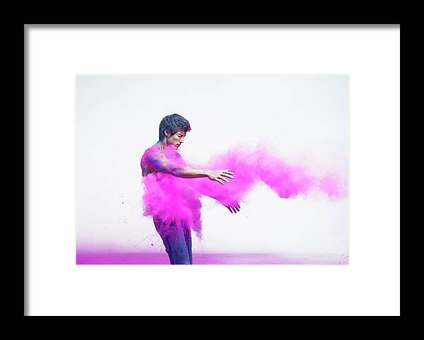 Three Quarter Length Framed Print featuring the photograph Man Being Impacted By Bright Pink by Tara Moore