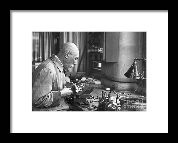 Working Framed Print featuring the photograph Man Cutting Diamonds In Shop by Bettmann