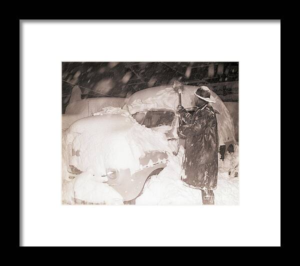 Problems Framed Print featuring the photograph Man Digging Automobile Out Of Snow by Bettmann