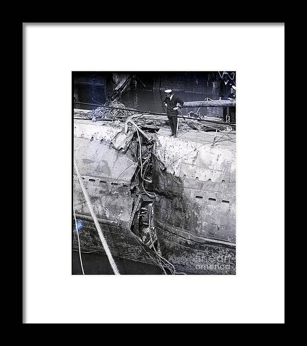 People Framed Print featuring the photograph Man Examining Hole Ripped In Hull by Bettmann