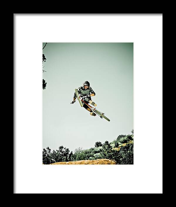 Young Men Framed Print featuring the photograph Man Jumping Mountain Bike In Mid-air by Doug Berry