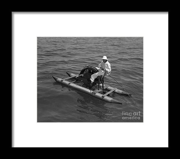 Young Men Framed Print featuring the photograph Man On Paddleboat Fishing by Bettmann