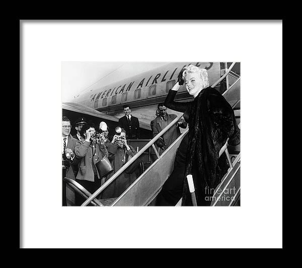 Marilyn Monroe Boards Airplane Framed Print by Bettmann