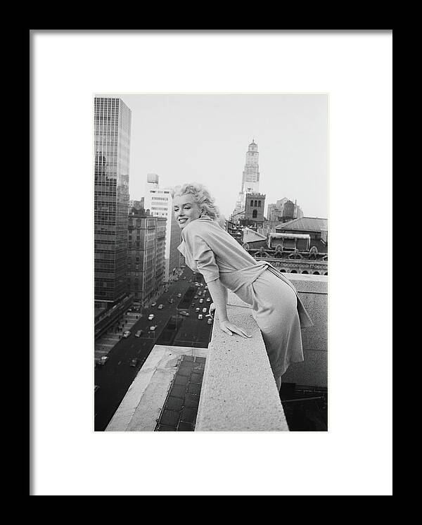 Marilyn Monroe Framed Print featuring the photograph Marilyn On The Roof by Michael Ochs Archives