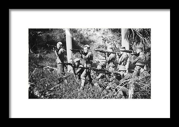 People Framed Print featuring the photograph Marines With Guns On Hatian Shore by Bettmann