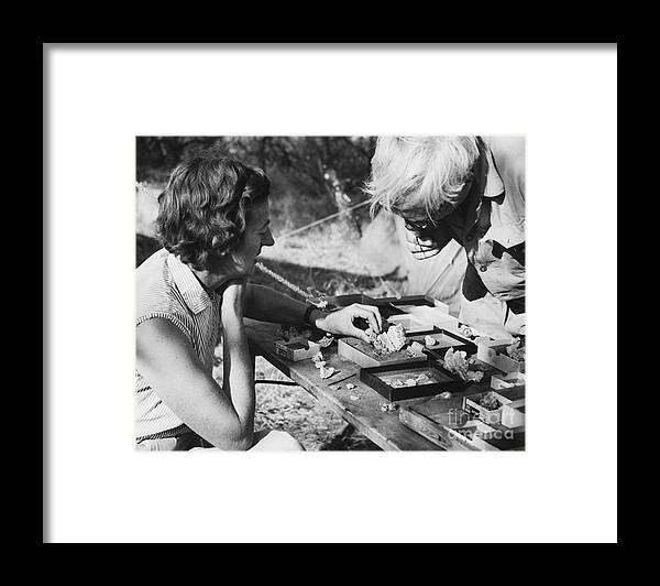 Kenya Framed Print featuring the photograph Mary And Louis Leakey Studying Skull by Bettmann