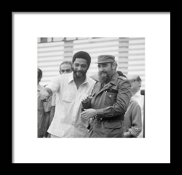 1980-1989 Framed Print featuring the photograph Maurice Bishop With Fidel Castro by Bettmann