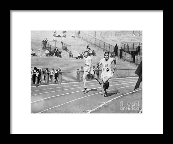 The Olympic Games Framed Print featuring the photograph Mens Olympic Relay Team In Action by Bettmann