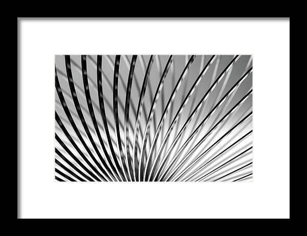Full Frame Framed Print featuring the photograph Metal Slinky by Deceptive Media