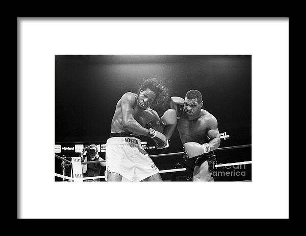 1980-1989 Framed Print featuring the photograph Mike Tyson Punches Mitch Green by Bettmann