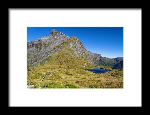 Backpackers Framed Print featuring the photograph Milford Track with the Mackinnon Memorial by David L Moore