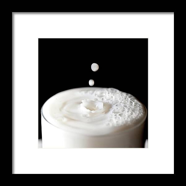Milk Framed Print featuring the photograph Milk Drops Falling In Glass Of Milk by Peter Chadwick Lrps
