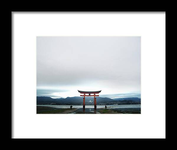 People Framed Print featuring the photograph Miyajima Gate At Low Tide At Dusk by Michael Duva